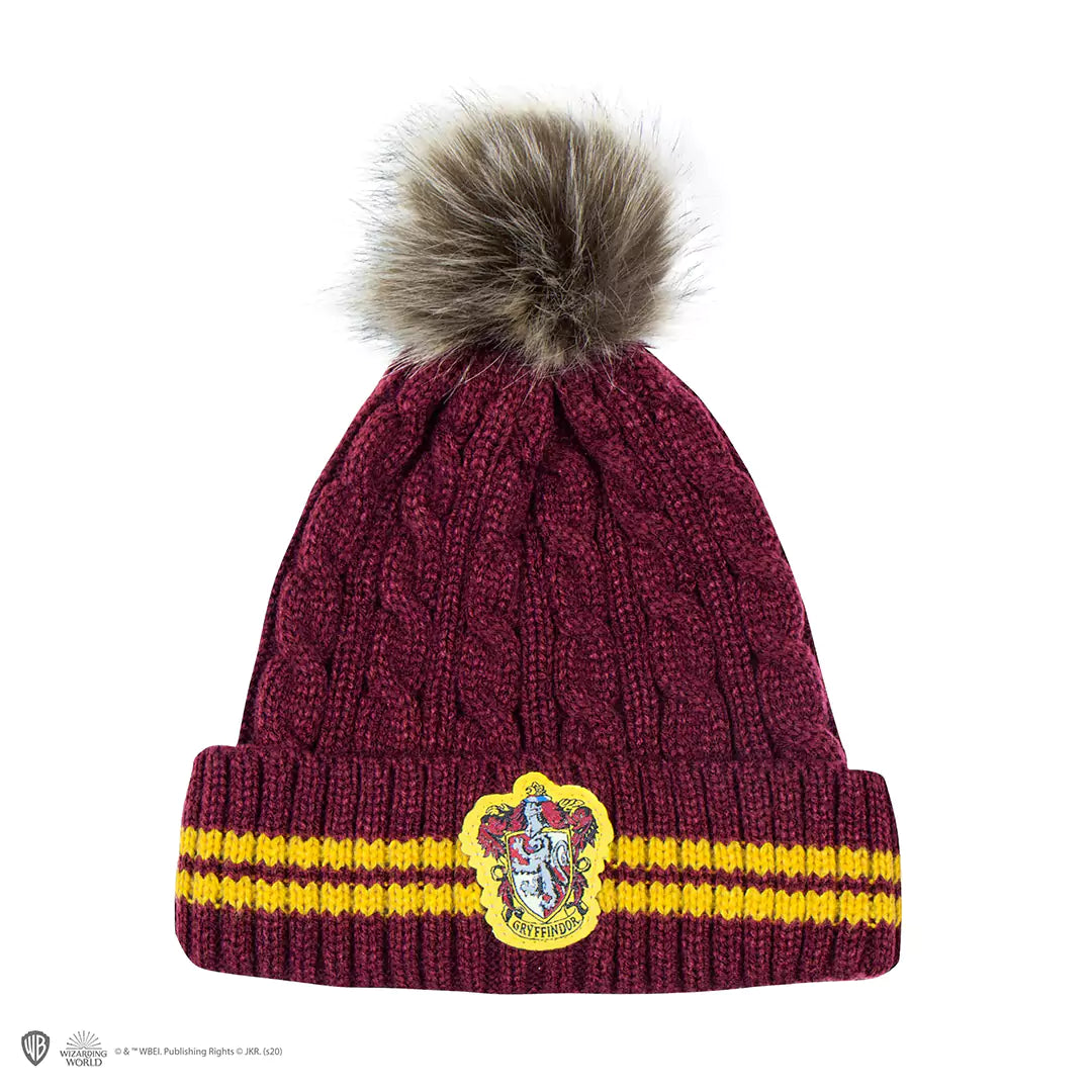 Bonnet à Pompon Gryffondor pourpre et or - Un accessoire unique pour les fans de Harry Potter, symbolisant courage et bravoure, parfait pour afficher votre allégeance à la Maison Gryffondor.