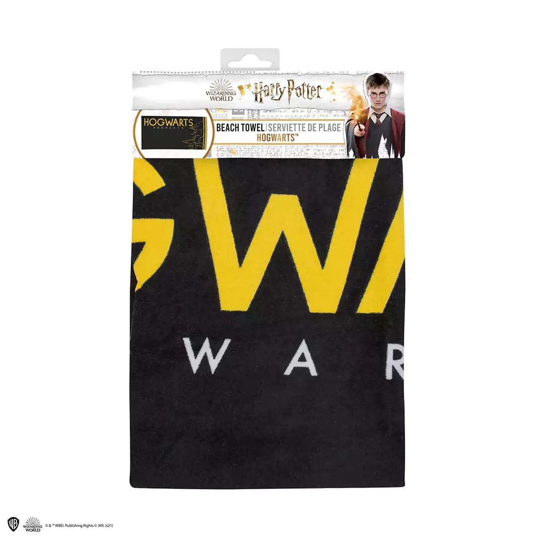 Détail de la serviette de plage Poudlard - Harry Potter, en coton de haute qualité, affichant les couleurs de l'école de sorcellerie.