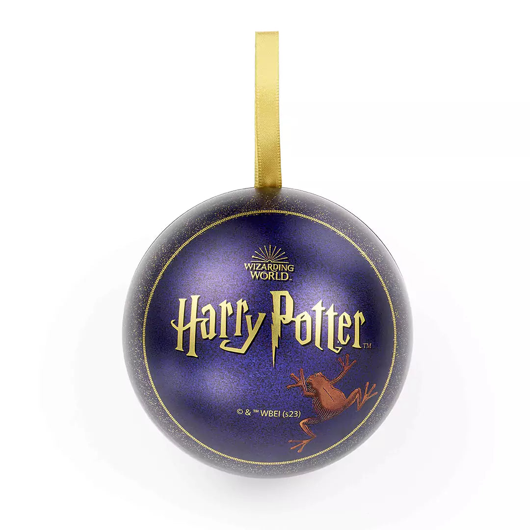 Boule de Noël Chocogrenouille - Pin’s - Harry Potter, un accessoire enchanteur à accrocher sur votre sapin ou votre veste, célébrant la magie de l'univers Harry Potter.