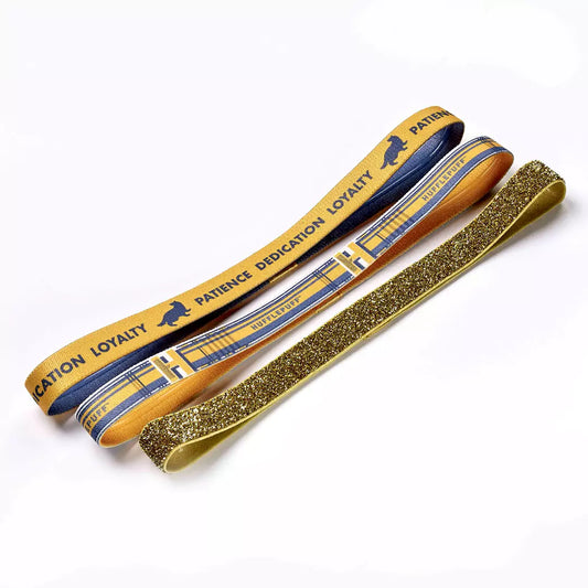 Set de bandeaux pour cheveux Poufsouffle - Harry Potter, mettant en valeur trois bandeaux élégants aux couleurs emblématiques de Poufsouffle.