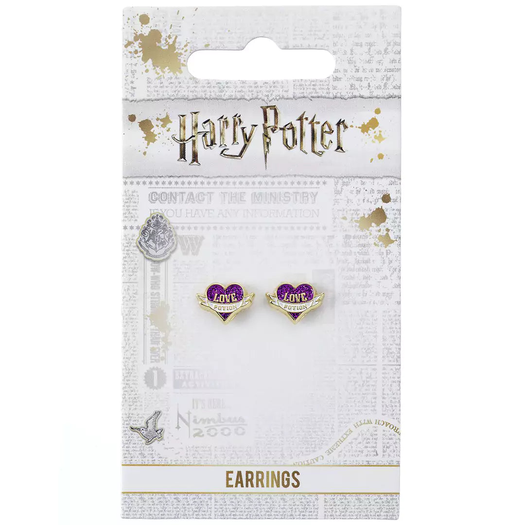 Close-up des boucles d’oreilles philtre d’amour Harry Potter, mettant en valeur les détails de l'émaillage et l'éclat du plaqué or, parfait pour les fans de magie.
