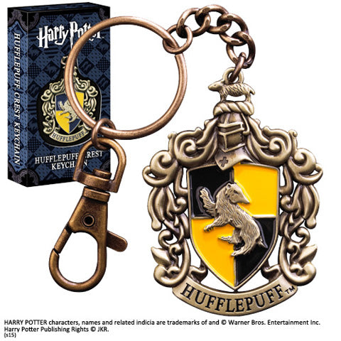 Porte-clés Maison Poufsouffle - Harry Potter, un élégant accessoire en métal et émail qui symbolise la loyauté et la camaraderie, parfait pour les fans de la saga magique.