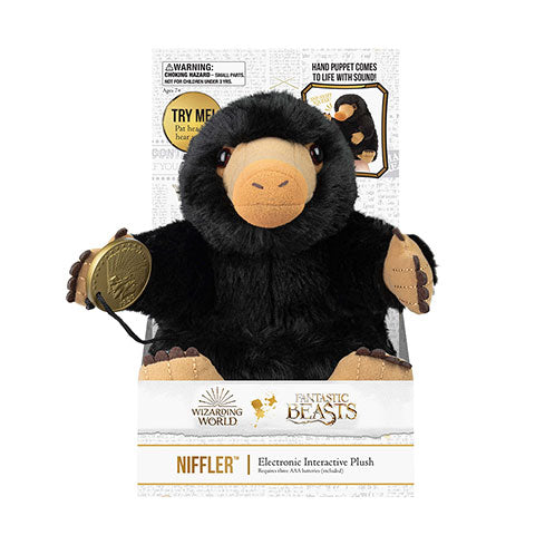 Niffleur - Peluche interactive - Les animaux fantastiques, un adorable compagnon en polyester de 22 cm émettant des sons magiques, parfait pour les fans de l'univers enchanteur.