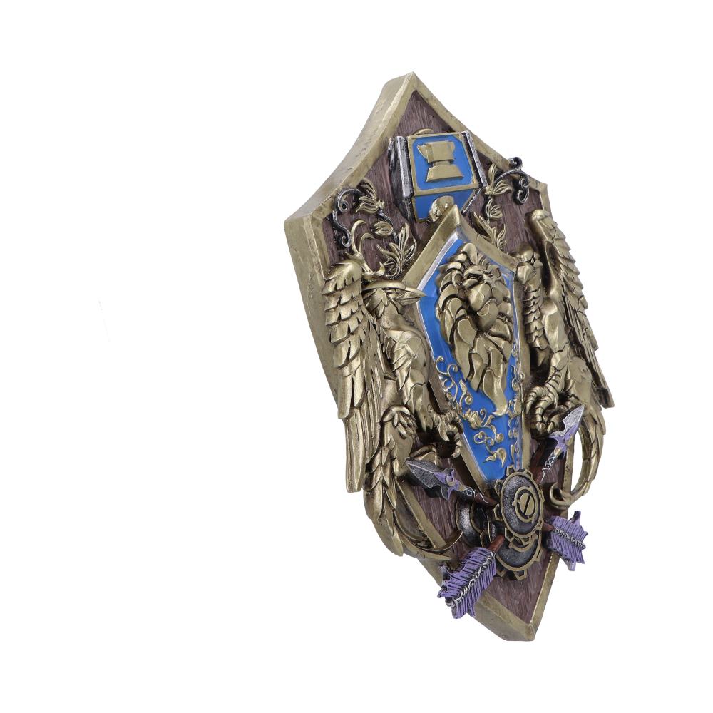 Plaque murale World of Warcraft Alliance 30cm de Nemesis Now, artisanat décoratif représentant le blason de l'Alliance dans des tons de bleu et d'or.
