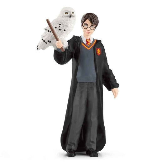 Figurine Harry Potter avec Hedwige par Ankorstore - Un hommage au monde magique de J.K. Rowling, capturant le jeune sorcier et sa chouette majestueuse en résine multicolore, idéale pour les collectionneurs.