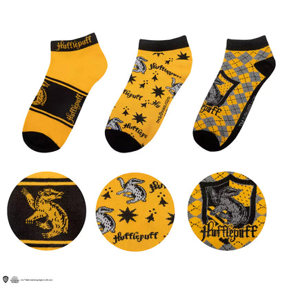 Lot de 3 paires de chaussettes courtes Poufsouffle - Harry Potter : une paire de chaussettes montrant les couleurs emblématiques de la maison Poufsouffle.
