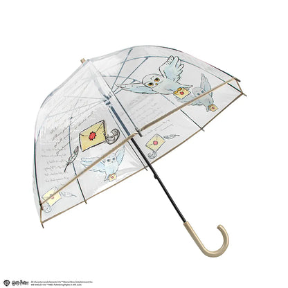 Parapluie transparent Hedwige Harry Potter sur fond élégant, capturant l'essence magique de l'univers sorcier.