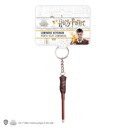 Porte clefs lumineux Harry Potter en action, illuminant une ambiance nocturne, parfait pour les fans d'Harry Potter.