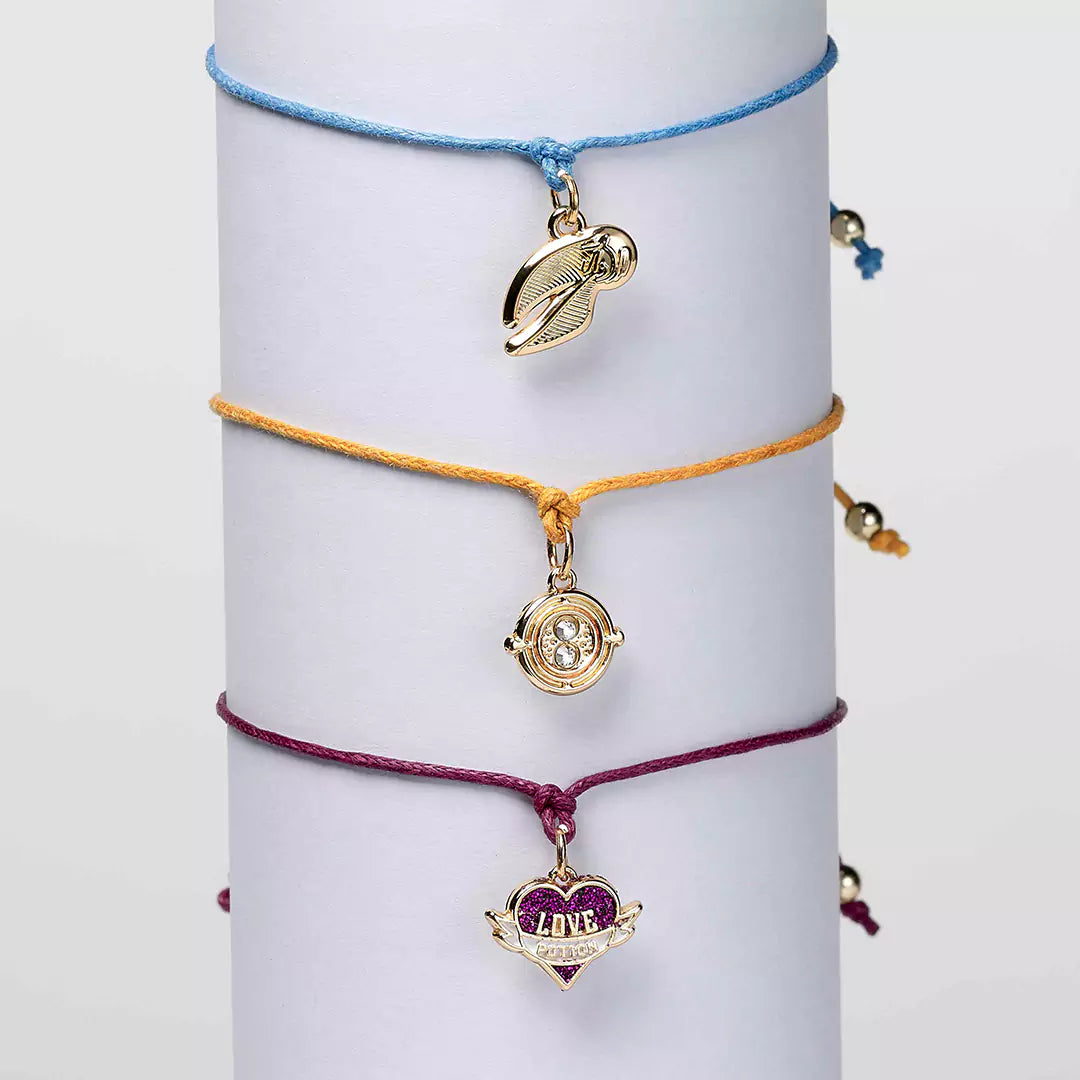 Bracelet d’amitié rose doré Harry Potter avec charme Love Potion, symbole d'amour et d'amitié.