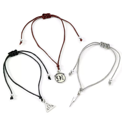 Bracelet d'amitié Harry Potter noir avec charme en forme de Reliques de la Mort - Lot de 3 bracelets d'amitié - Argentés - Harry Potter.