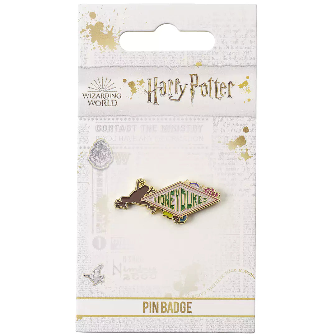 Détails du pin's Honeydukes, emblème emblématique de la confiserie de Pré-au-Lard dans le monde de Harry Potter.