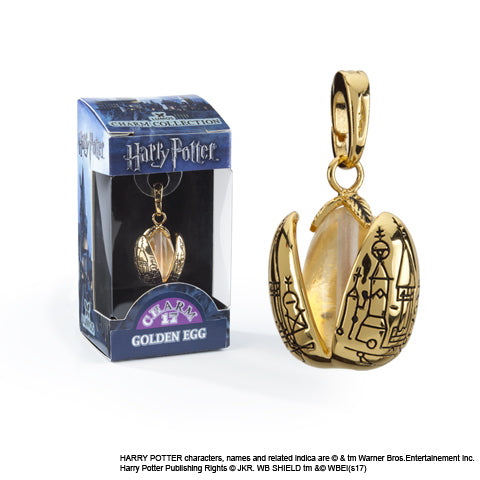 Charm Lumos L’oeuf d’or inspiré de l'univers magique d'Harry Potter, bijou en plaqué or symbolisant lumière et espoir.