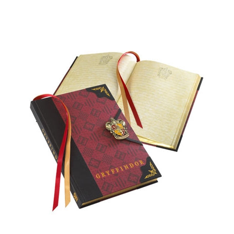 Journal Gryffondor - Harry Potter, un carnet emblématique aux pages blanches, conçu par Noble Collection, parfait pour capturer vos pensées et aventures magiques.