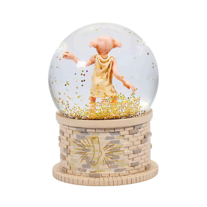Boule à neige en boîte 65 mm - Harry Potter Dobby de Half Moon Bay, captivant avec un elfe Dobby entouré de flocons scintillants.