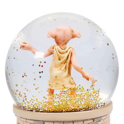 Boule à neige Harry Potter Dobby en boîte cadeau par Half Moon Bay, un objet décoratif qui évoque la magie de la saga.