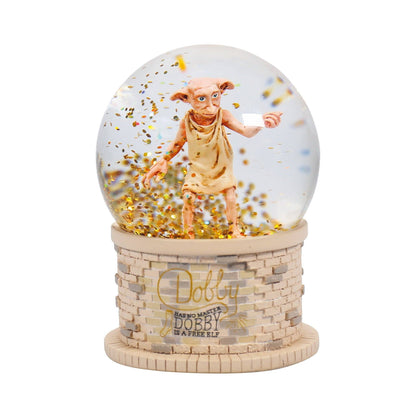 Boule à neige en boîte 65 mm - Harry Potter Dobby de Half Moon Bay, représentant le célèbre elfe Dobby au milieu de flocons scintillants, parfait pour les fans de la saga.