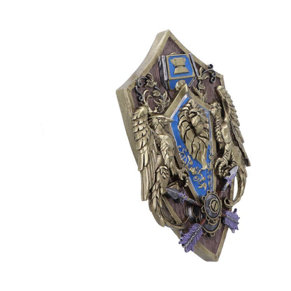 Plaque murale World of Warcraft Alliance 30cm de Nemesis Now, artisanat décoratif représentant le blason de l'Alliance dans des tons de bleu et d'or.